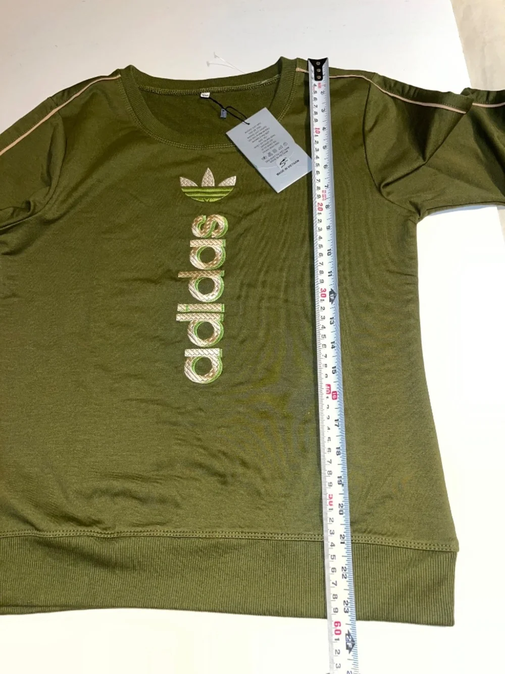 olive green Adidas matching sweatshirt and jogger set